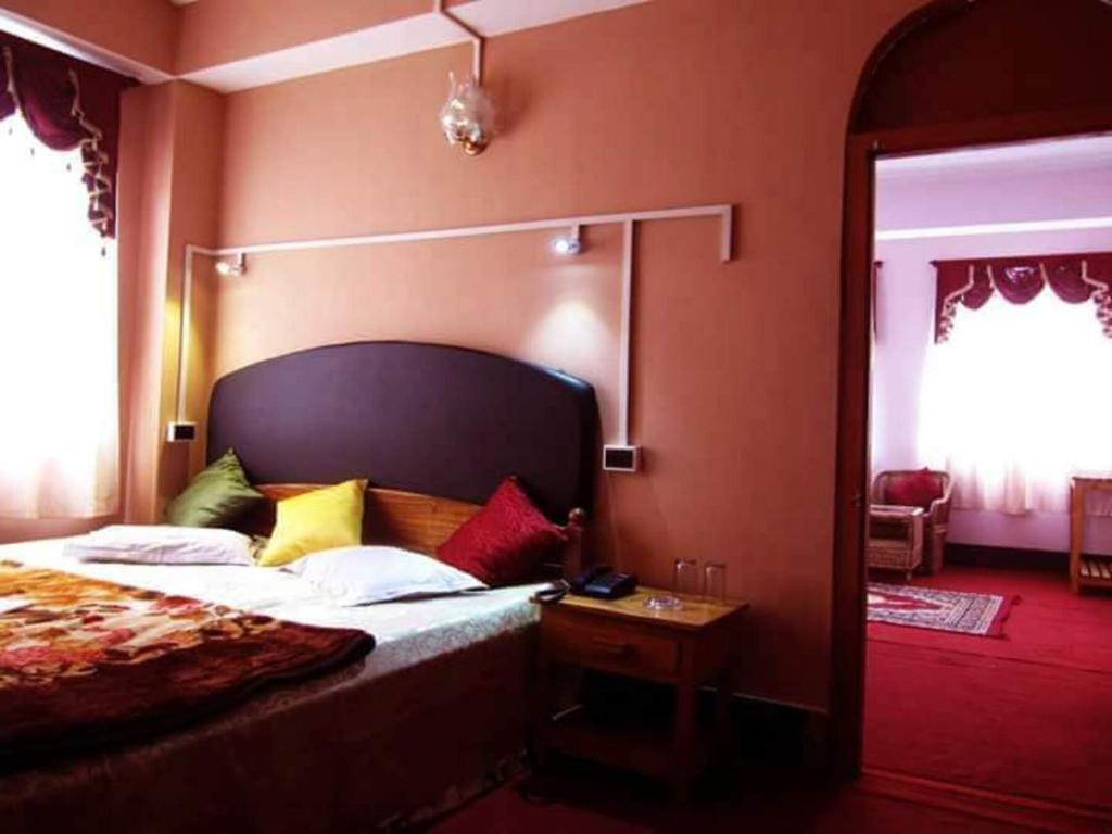 Postel nebo postele na pokoji v ubytování Hotel Kanchan View