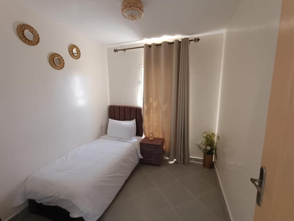 Postel nebo postele na pokoji v ubytování Mini villa dakhla