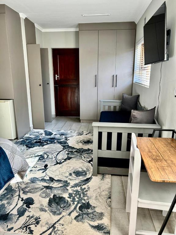 TV o dispositivi per l'intrattenimento presso Guesthouse Grace At The Bay