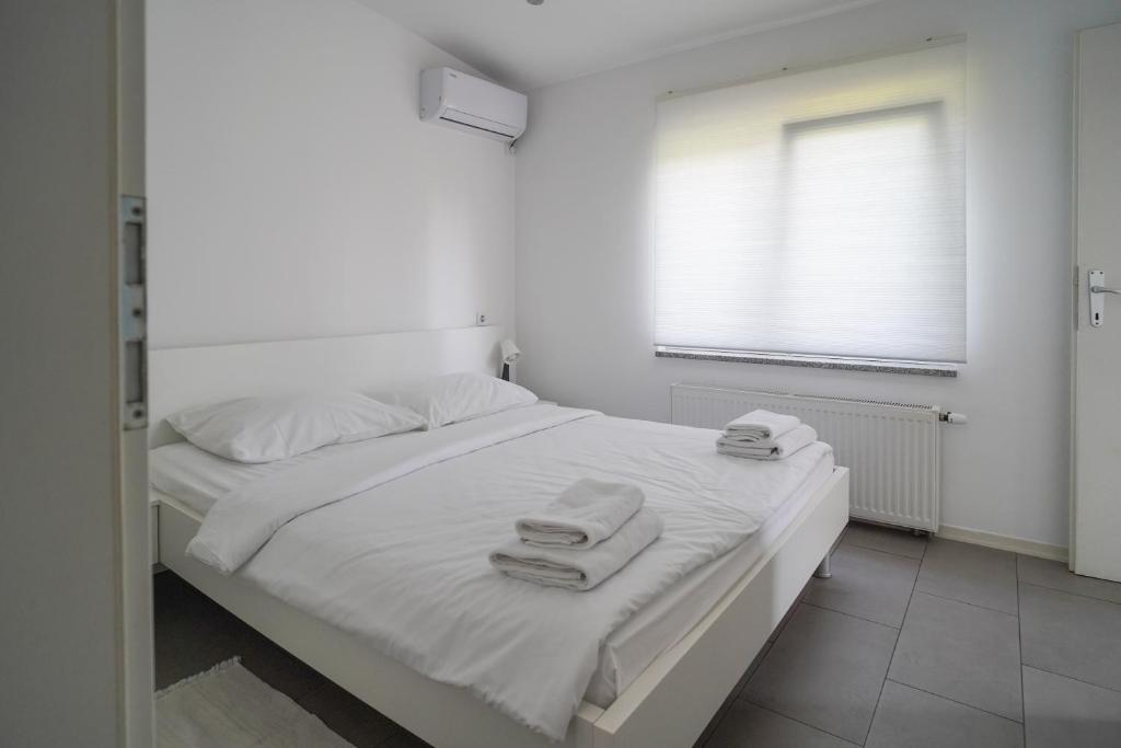 Postel nebo postele na pokoji v ubytování Apartments Choice
