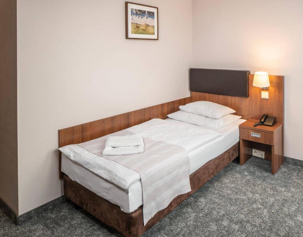 Postel nebo postele na pokoji v ubytování Maximus Spa
