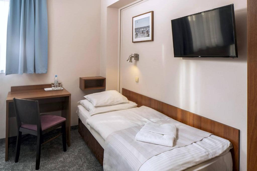 Postel nebo postele na pokoji v ubytování Maximus Spa