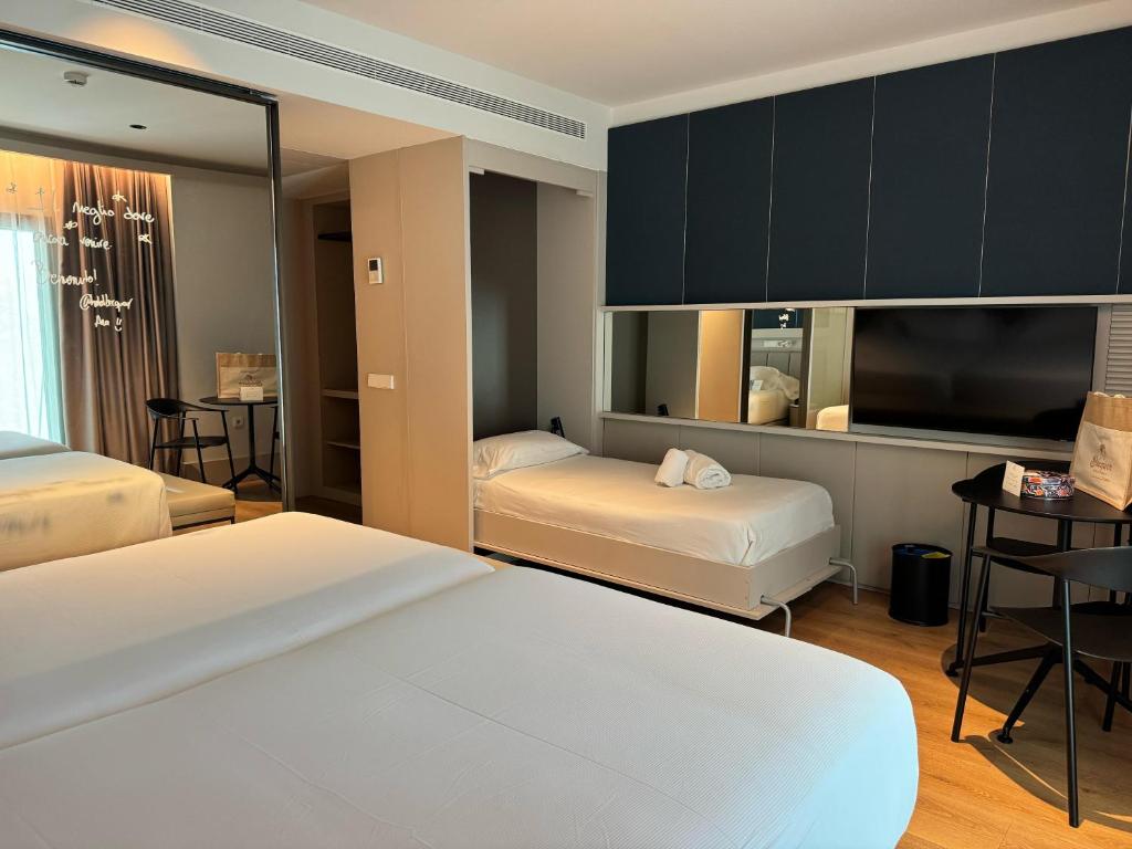 Postel nebo postele na pokoji v ubytování Hotel Bécquer