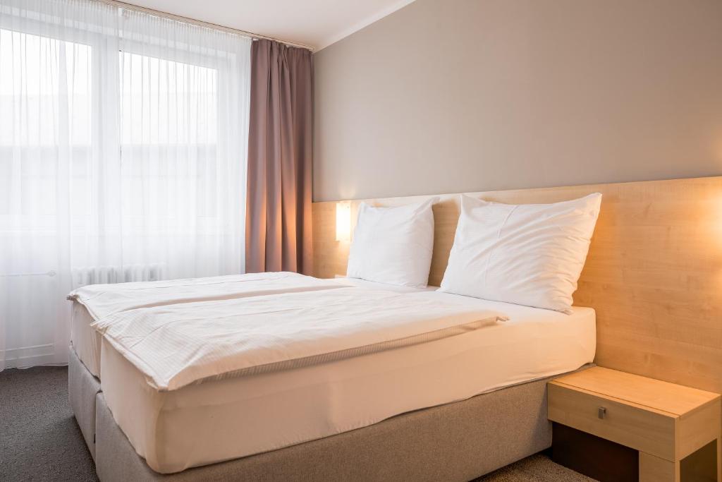 Postel nebo postele na pokoji v ubytování Hotel Vista