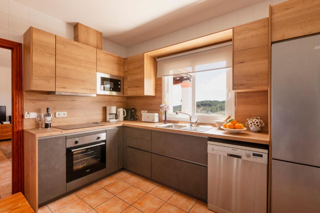 Kuchyň nebo kuchyňský kout v ubytování Villa Can Ameler
