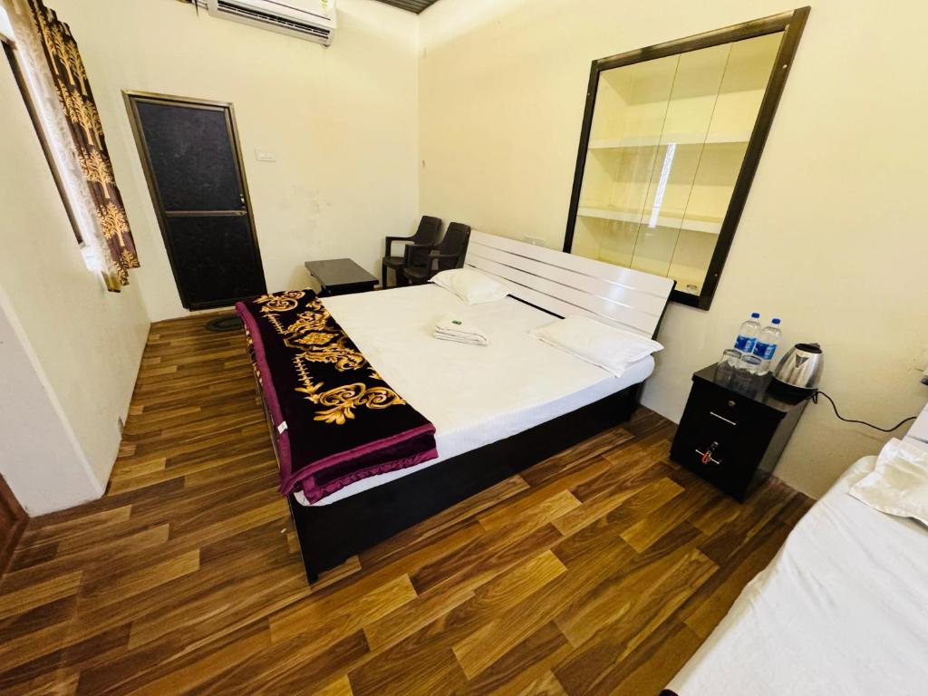 Postel nebo postele na pokoji v ubytování Millenium Residency