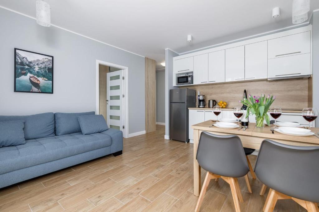 Η κουζίνα ή μικρή κουζίνα στο Stylish Apartment Rybacka with Parking by Noclegi Renters