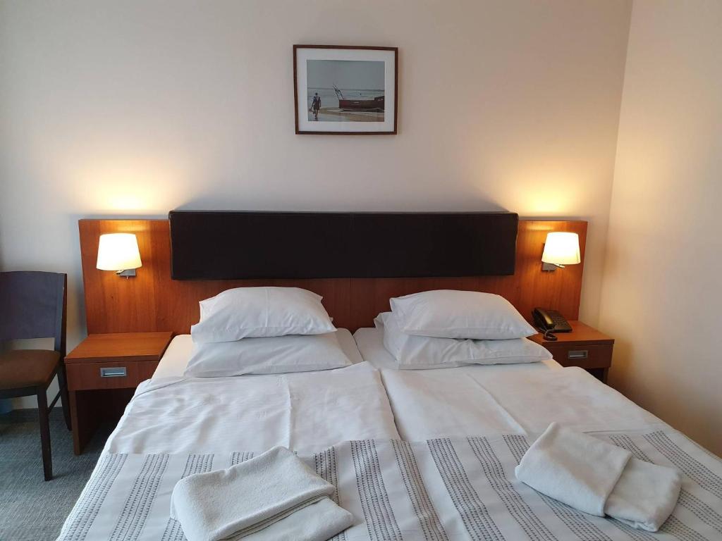 Postel nebo postele na pokoji v ubytování Maximus Spa