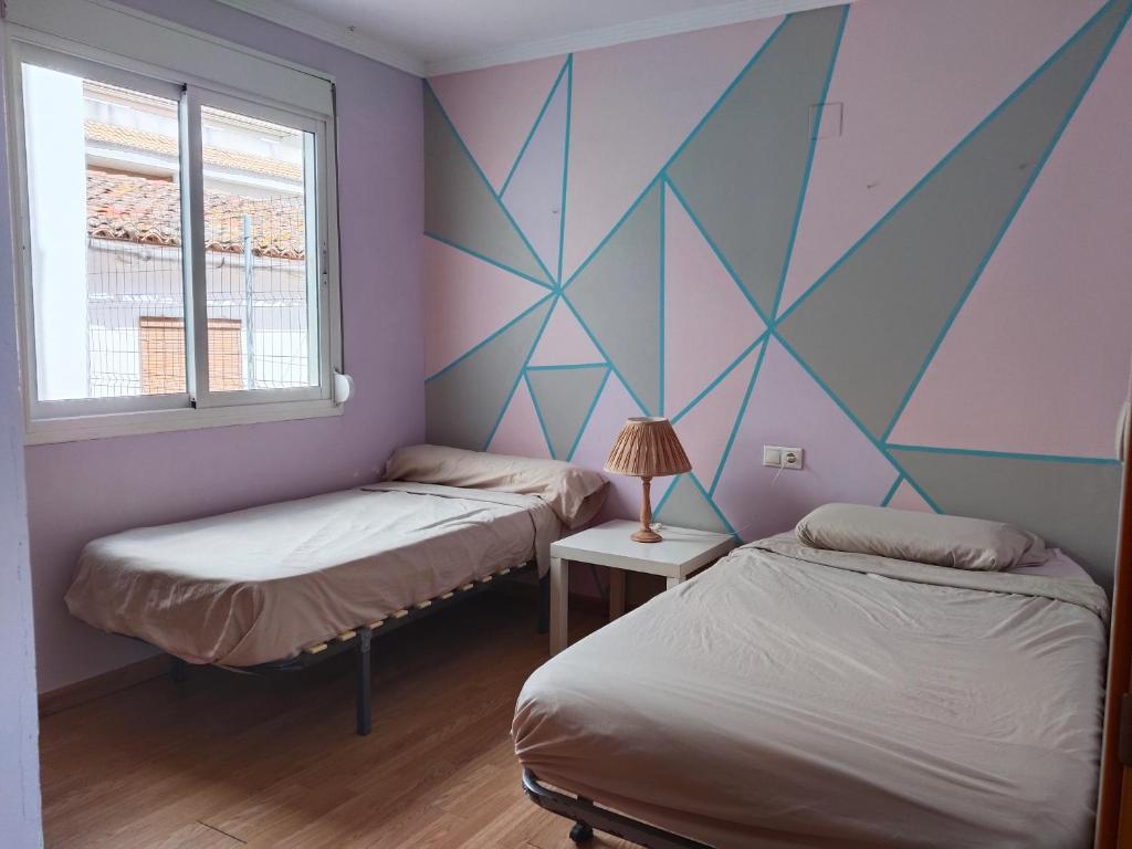 Postel nebo postele na pokoji v ubytování apartamento Daimuz playa