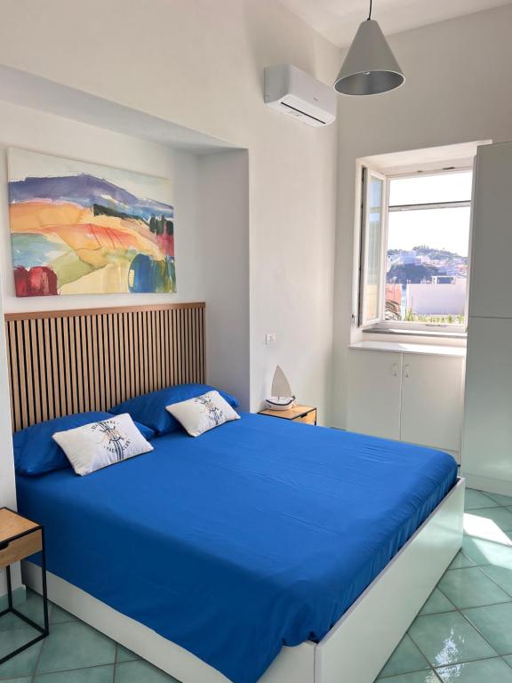 Postel nebo postele na pokoji v ubytování Sea Breeze Ponza