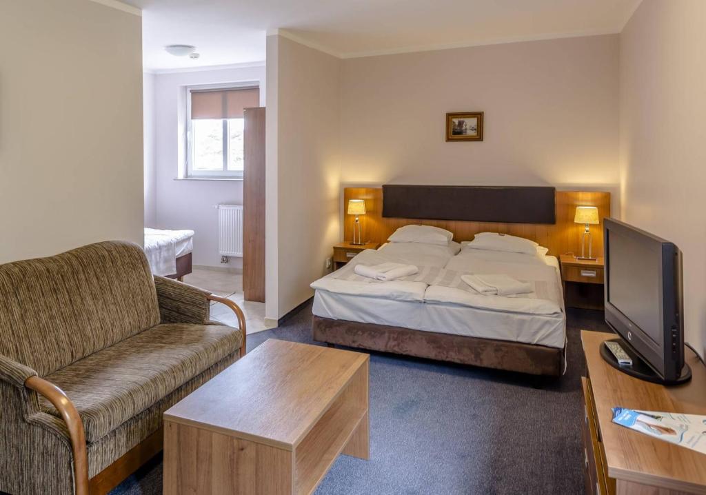 Postel nebo postele na pokoji v ubytování Maximus Spa