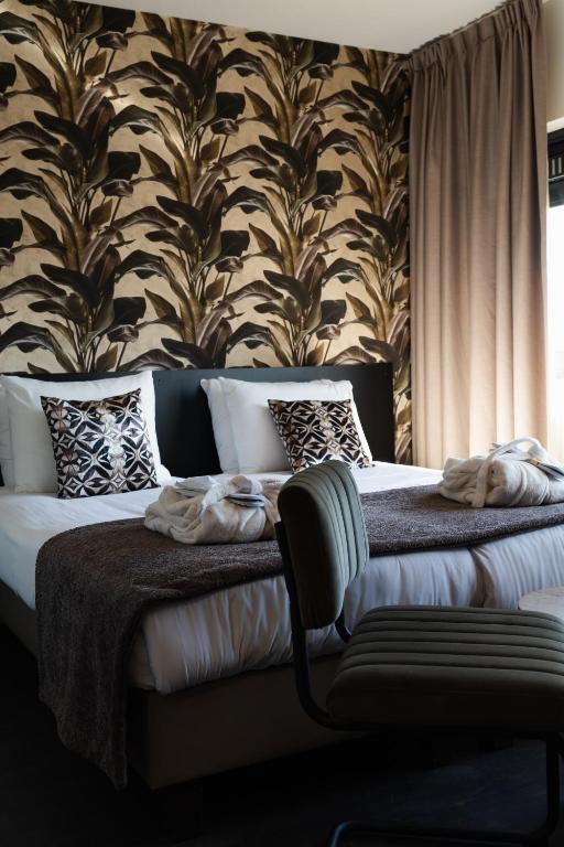 Llit o llits en una habitació de Hotel Wander