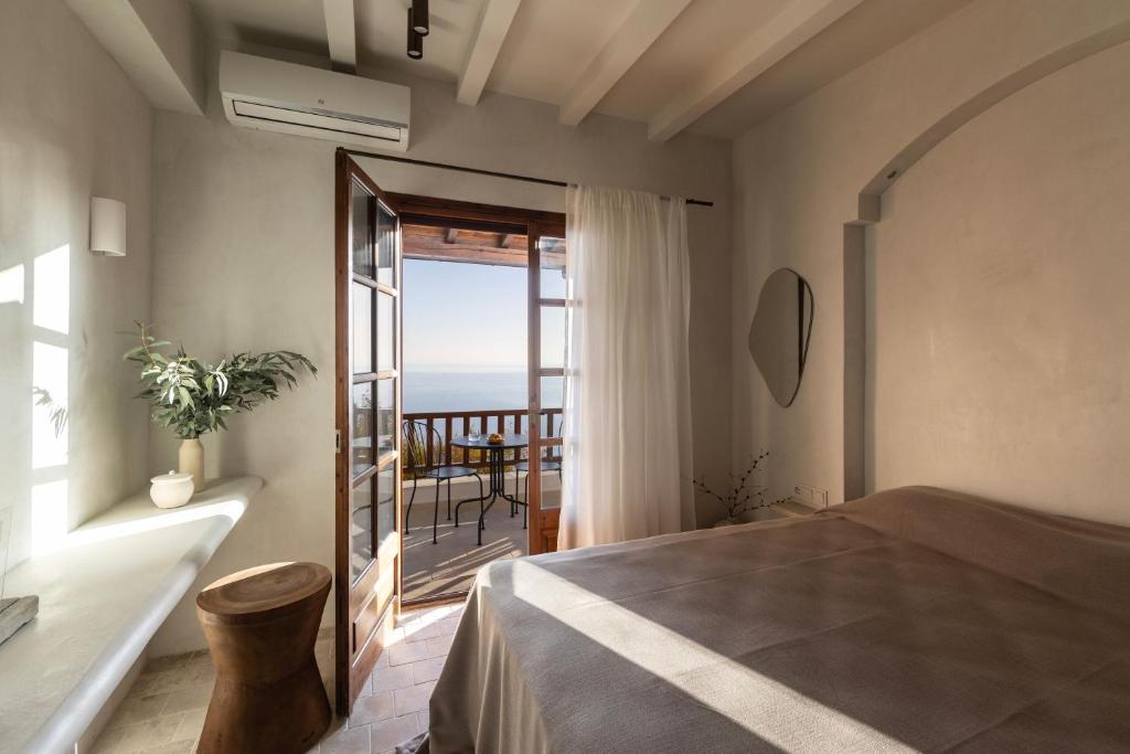 Postel nebo postele na pokoji v ubytování Om Living Pelion