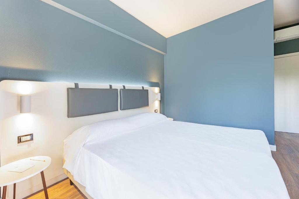 Postel nebo postele na pokoji v ubytování Elba Vibe Smart Hotel