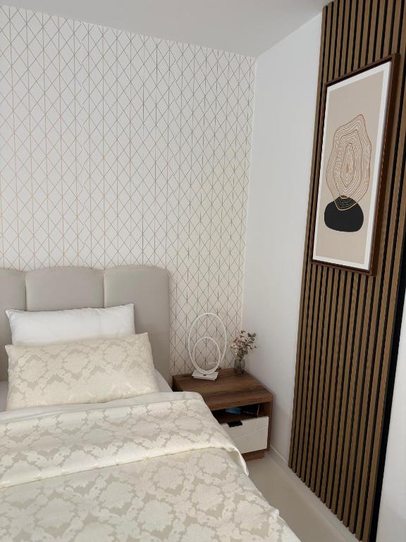 Postel nebo postele na pokoji v ubytování Apartmani Beril Lux