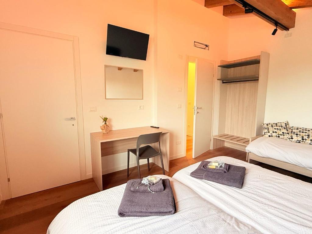 Postel nebo postele na pokoji v ubytování B-Village Bar and Rooms
