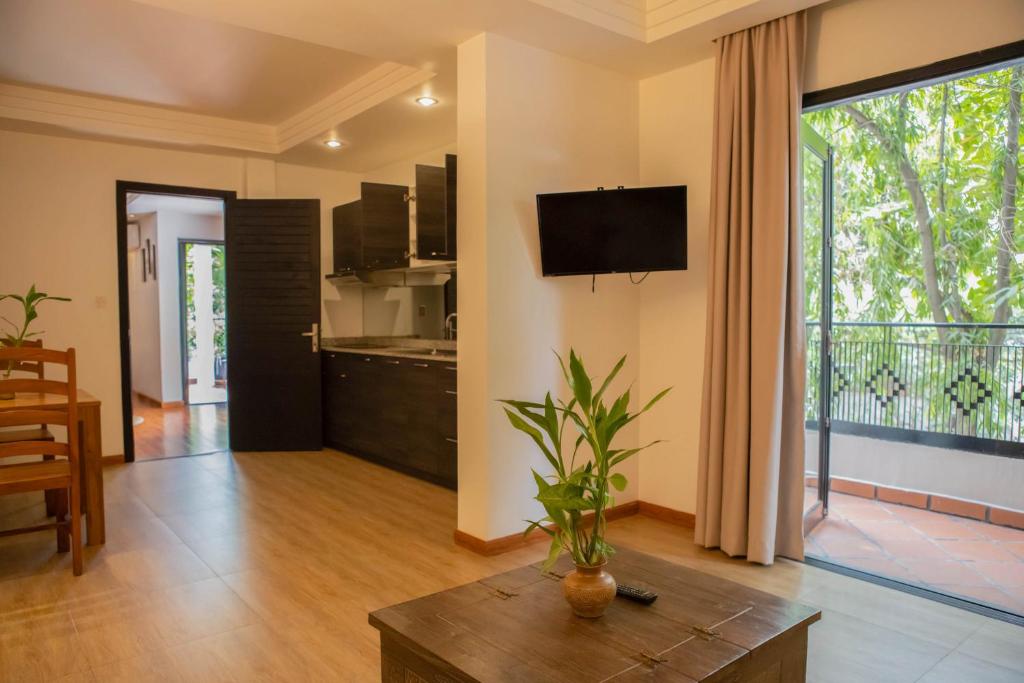 TV a/nebo společenská místnost v ubytování La Rose Suites