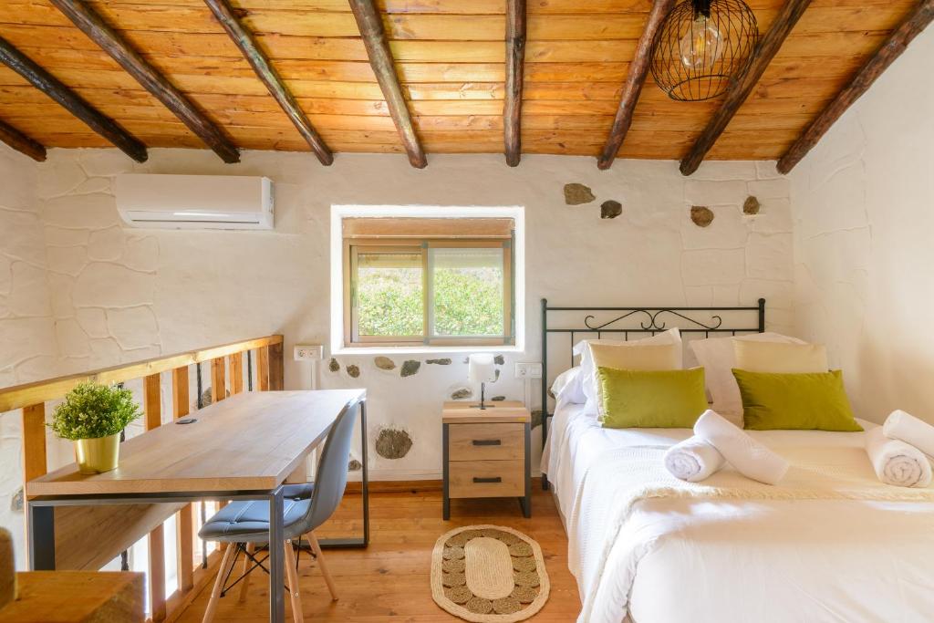 Postel nebo postele na pokoji v ubytování Quinta entre palmeras