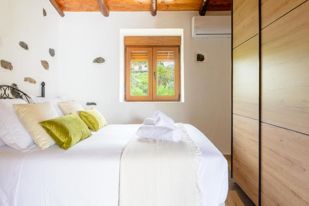 Postel nebo postele na pokoji v ubytování Quinta entre palmeras