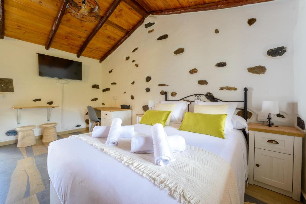 Postel nebo postele na pokoji v ubytování Quinta entre palmeras