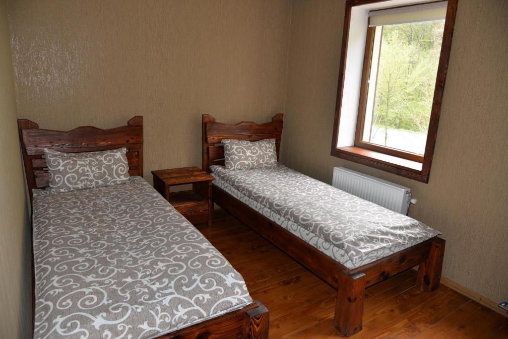 Postel nebo postele na pokoji v ubytování Syni Potoky