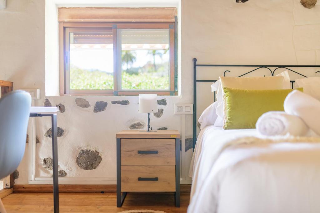 Postel nebo postele na pokoji v ubytování Quinta entre palmeras