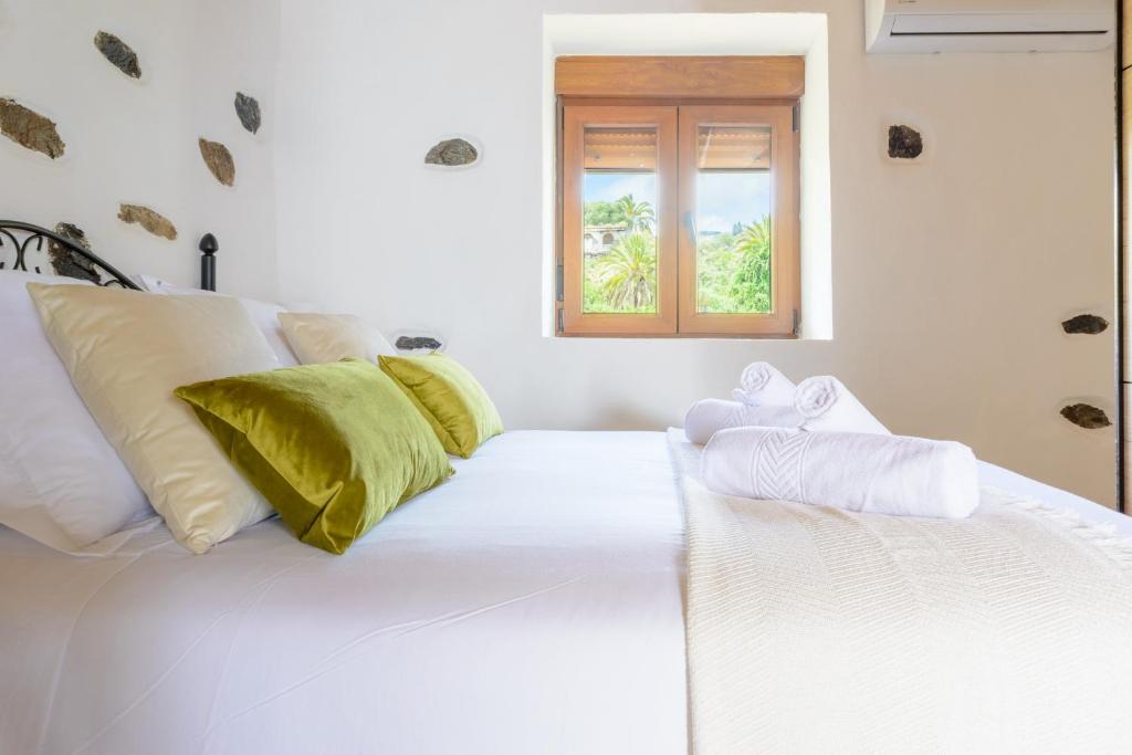 Postel nebo postele na pokoji v ubytování Quinta entre palmeras