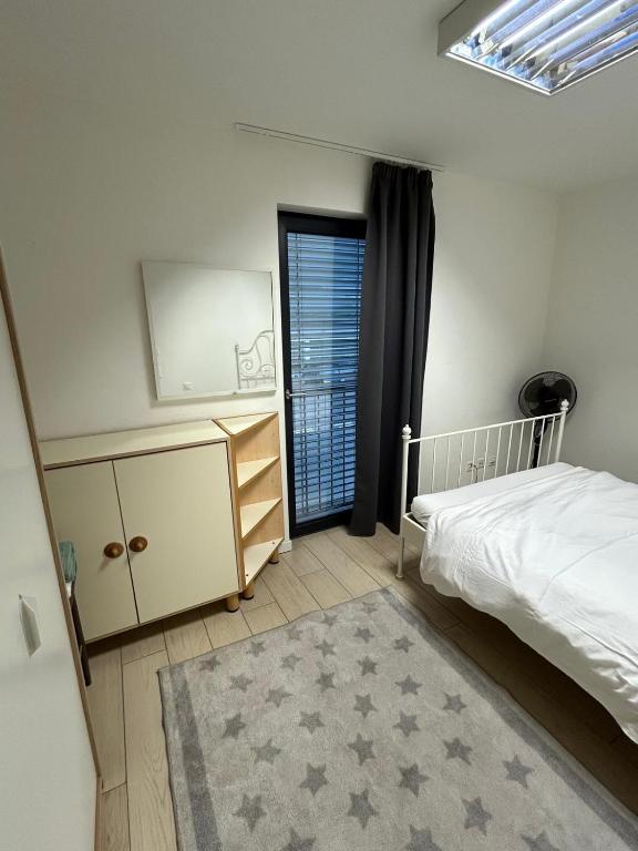 Postel nebo postele na pokoji v ubytování KKD RESIDENCE Balerna