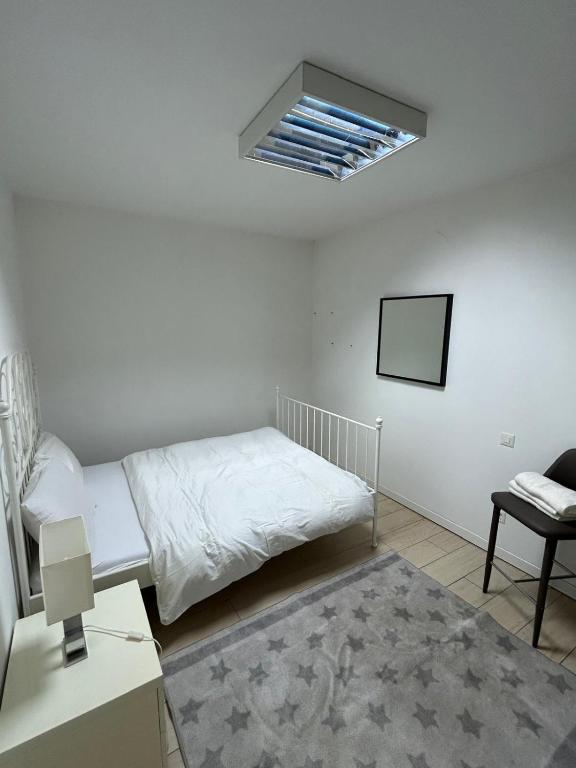 Postel nebo postele na pokoji v ubytování KKD RESIDENCE Balerna