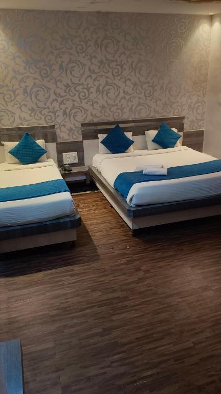 Postel nebo postele na pokoji v ubytování Hotel Kiara Eshosans Palace