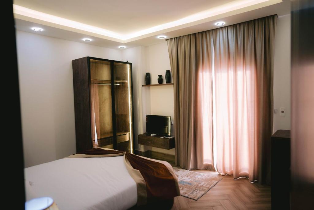 TV a/nebo společenská místnost v ubytování Pyramids Sunshine Hotel