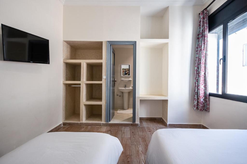 Rúm í herbergi á Hotel Mauritania