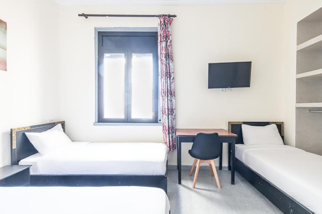 Rúm í herbergi á Hotel Mauritania