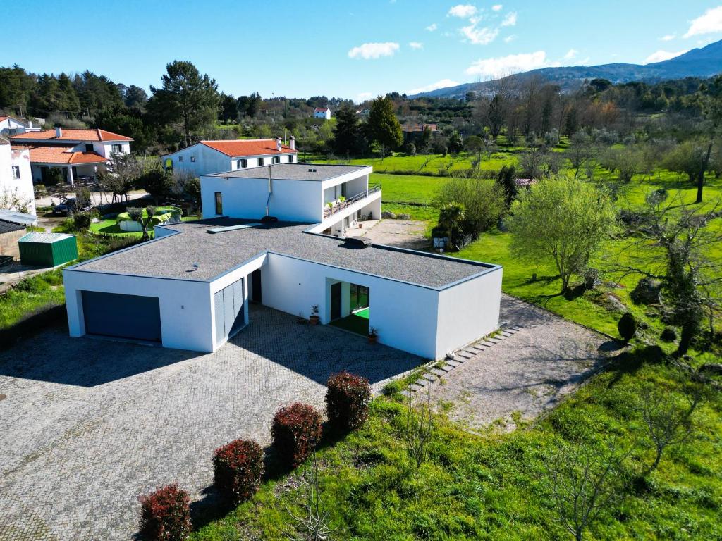 an aerial view of a house with a roof at Fabulous 5 BR hidden gem Serra da Estrela in Vinhó