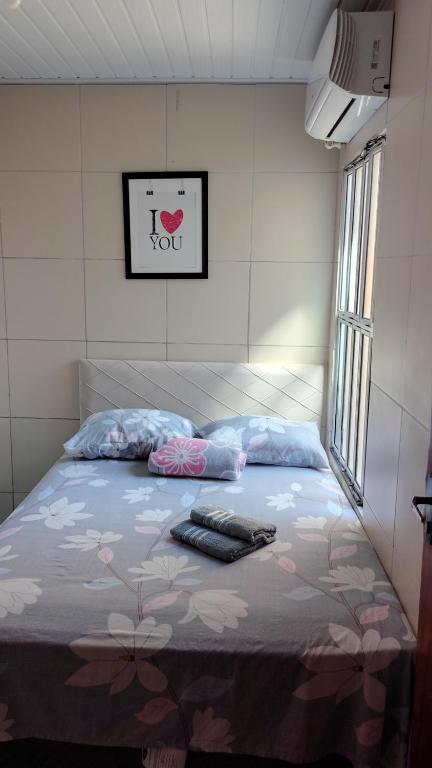 a bedroom with a bed with a hello kitty blanket at Ponta Verde CENTRAL in Maceió
