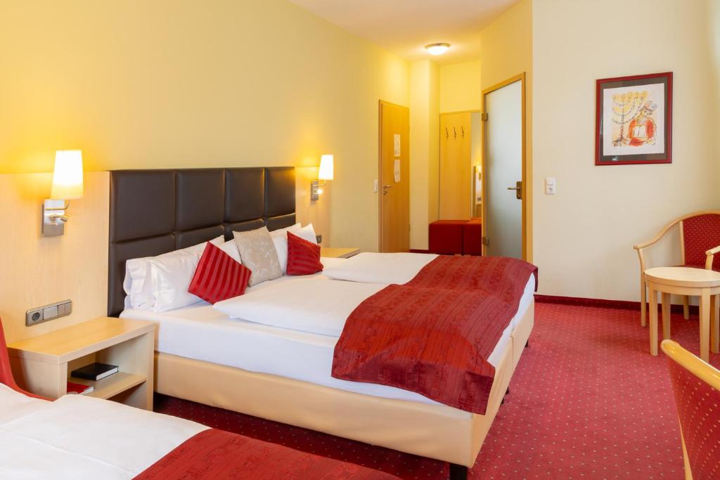 Postel nebo postele na pokoji v ubytování Hotel An der Eiche