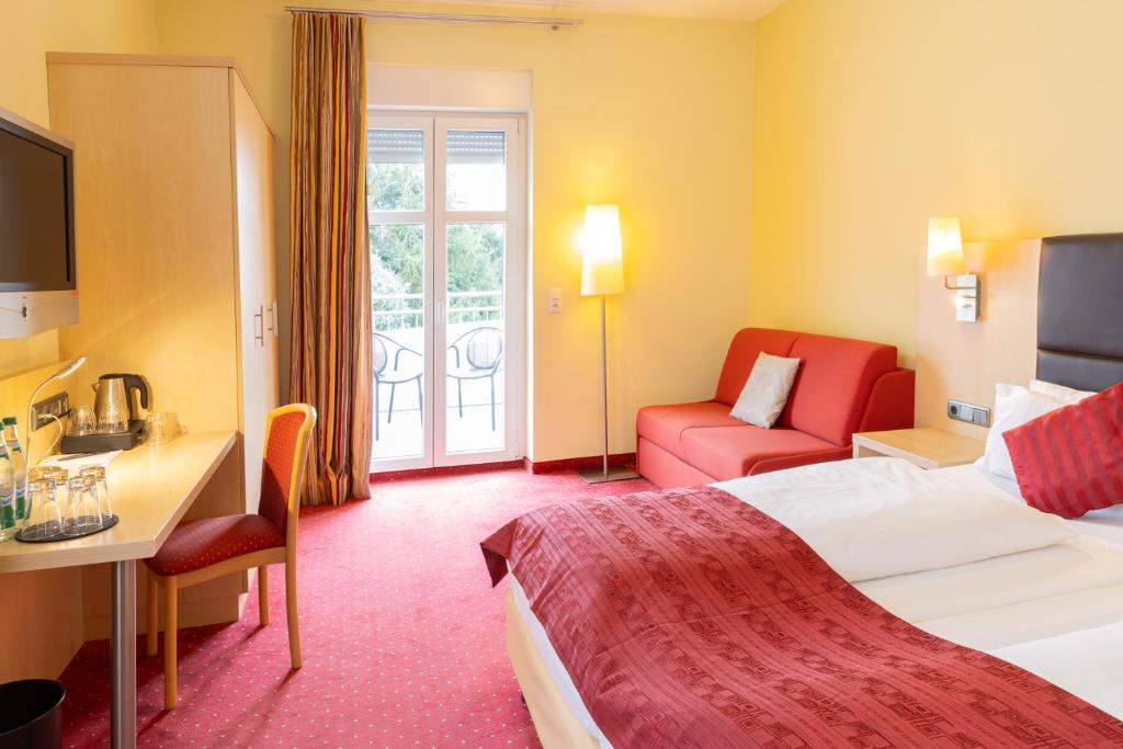 Postel nebo postele na pokoji v ubytování Hotel An der Eiche