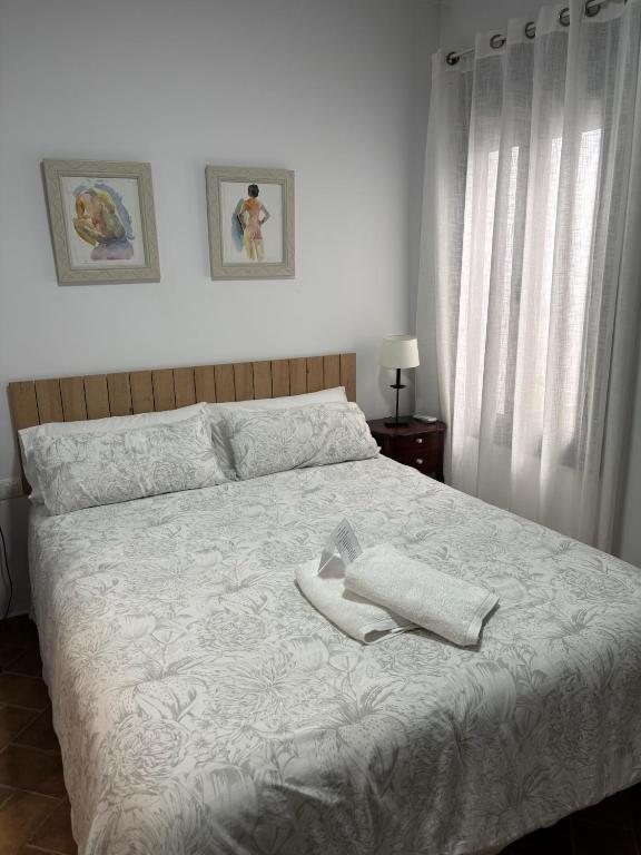 Posteľ alebo postele v izbe v ubytovaní Niebla Centro Apartamentos
