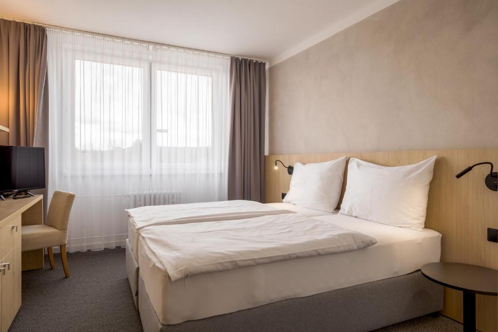 Postel nebo postele na pokoji v ubytování Hotel Vista