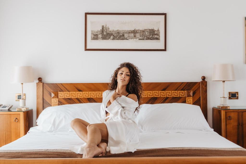 Postel nebo postele na pokoji v ubytování Hotel Vittoria
