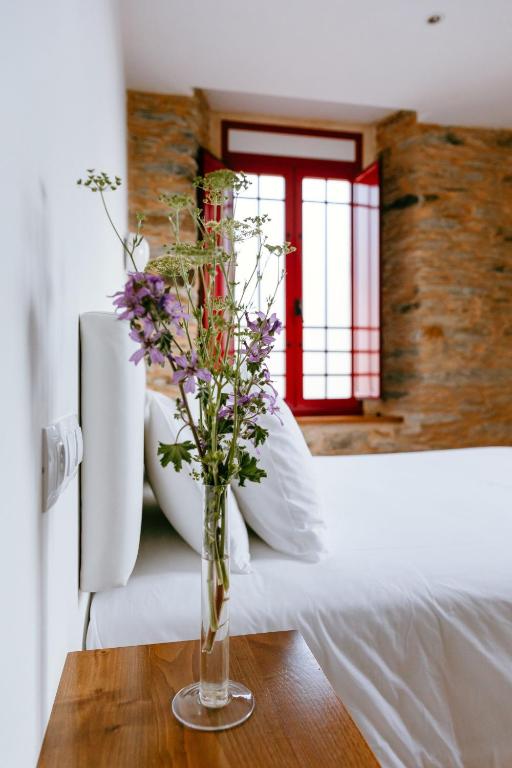 Postel nebo postele na pokoji v ubytování Hotel El Castaño Dormilón