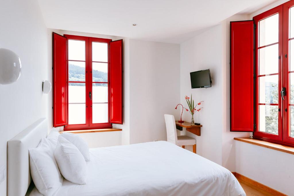 Postel nebo postele na pokoji v ubytování Hotel El Castaño Dormilón