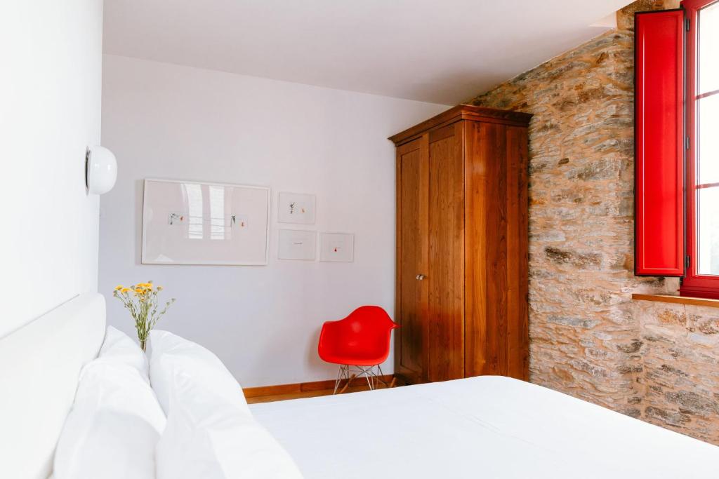 Postel nebo postele na pokoji v ubytování Hotel El Castaño Dormilón
