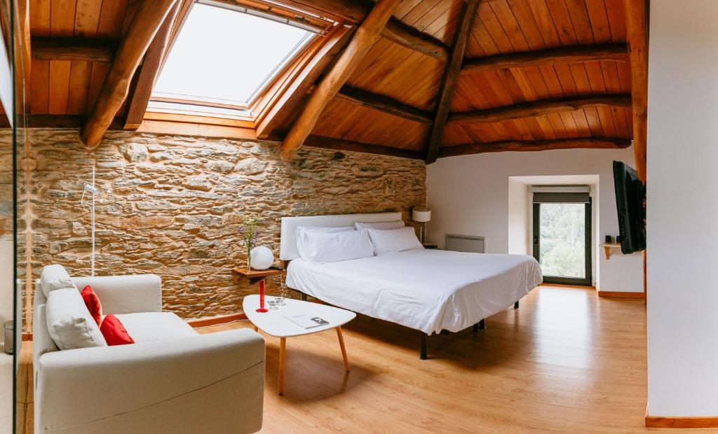Postel nebo postele na pokoji v ubytování Hotel El Castaño Dormilón