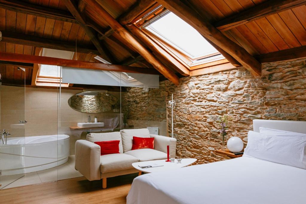 Postel nebo postele na pokoji v ubytování Hotel El Castaño Dormilón