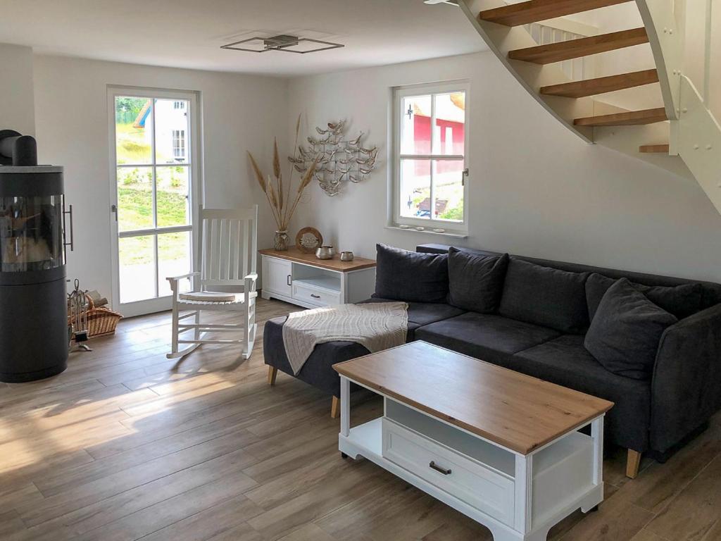 a living room with a couch and a table at FH Ankerplatz in Güstow
