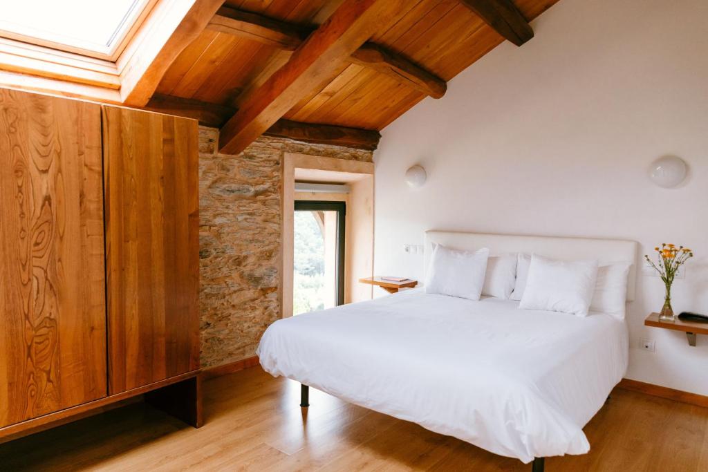 Postel nebo postele na pokoji v ubytování Hotel El Castaño Dormilón