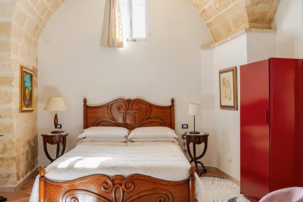 Postel nebo postele na pokoji v ubytování B&B Corte dei Memoli di Margiotta Giuseppina