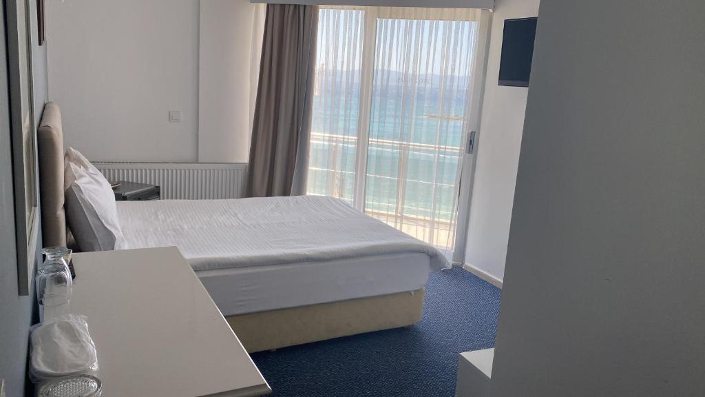 Postel nebo postele na pokoji v ubytování Pasifik Hotel