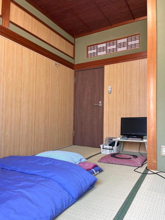 TV a/nebo společenská místnost v ubytování Guesthouse Hikari